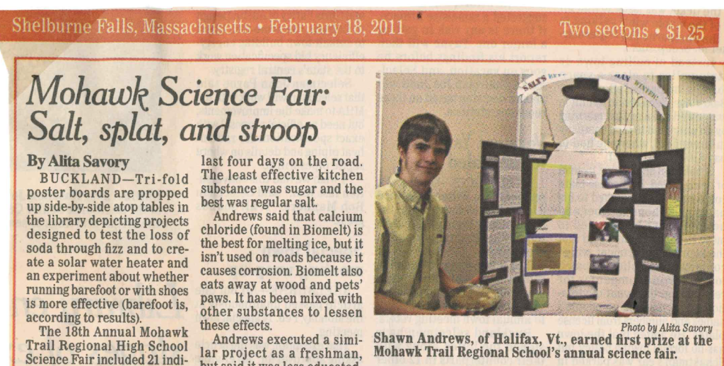 Student standing in front of trifold